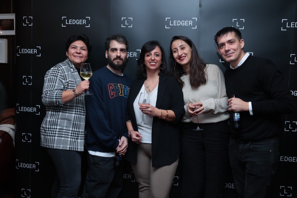 Burcu with four guests in front of a Ledger backdrop at Ledger Op3n Istanbul